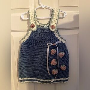 Hand crocheted baby frock with strawberries ribbon appliqué